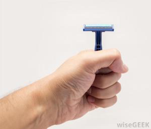 man-holding-a-blue-razor-in-hand